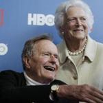 FILE - In a Tuesday, June 12, 2012 file photo, former President George H.W. Bush, and his wife former first lady Barbara Bush, arrive for the premiere of HBO's new documentary on his life near the family compound in Kennebunkport, Maine. The 41st president's month-long stay in a Houston hospital for treatment of a bronchitis-related cough appears to be nearing an end. A spokesman said Thursday, Dec. 20, 2012 that Bush possibly will be released from Methodist Hospital over the weekend and be home for Christmas. (AP Photo/Charles Krupa, File)
